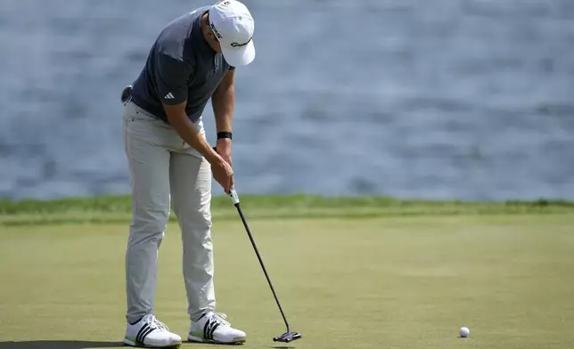 Jacob Bridgeman putts on the 18th green during the first round of the 3M Open golf tournament at the Tournament Players Club, Thursday, July 25, 2024, in Blaine, Minn. (AP Photo/Charlie Neibergall)