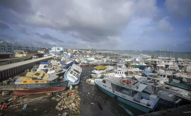 Fishing vessels lie damaged after Hurricane Beryl passed through the Bridgetown Fisheries in Barbados, Monday, July 1, 2024. (AP Photo/Ricardo Mazalan)