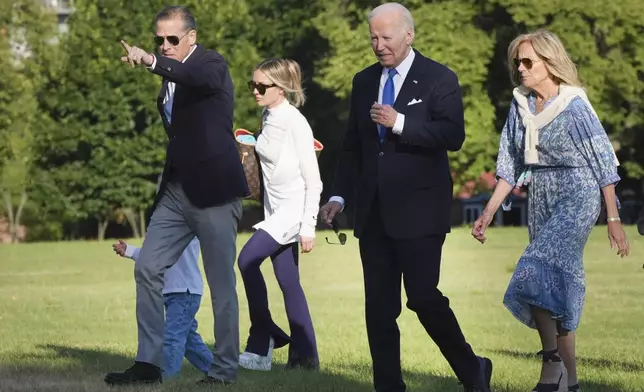 President Joe Biden, second from right, first lady Jill Biden, right, and from left, Hunter Biden, Beau Biden, obstructed, and Melissa Cohen Biden arrive at Fort Lesley J. McNair, Monday, July 1, 2024, in Washington, on return from Camp David. (AP Photo/Jacquelyn Martin)
