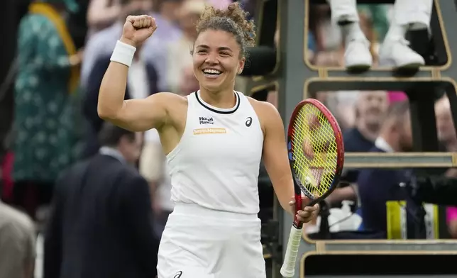 Jasmine Paolini of Italy celebrates after defeating Emma Navarro of the United States in their quarterfinal match at the Wimbledon tennis championships in London, Tuesday, July 9, 2024. (AP Photo/Alberto Pezzali)