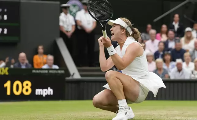 Lulu Sun of New Zealand celebrates after defeating Emma Raducanu of Britain in their fourth round match at the Wimbledon tennis championships in London, Sunday, July 7, 2024. (AP Photo/Alberto Pezzali)