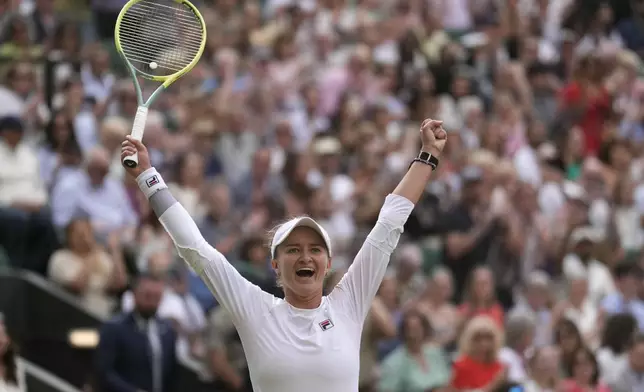 Barbora Krejcikova of the Czech Republic celebrates after defeating Elena Rybakina of Kazakhstan in their semifinal match at the Wimbledon tennis championships in London, Thursday, July 11, 2024. (AP Photo/Mosa'ab Elshamy)
