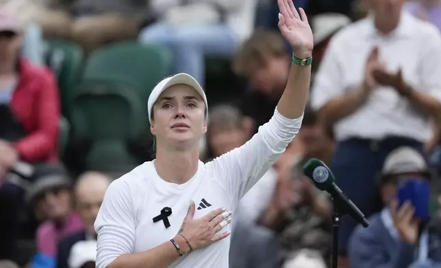 Elina Svitolina of Ukraine waves after defeating Xinyu Wang of China in their fourth round match at the Wimbledon tennis championships in London, Monday, July 8, 2024. (AP Photo/Mosa'ab Elshamy)