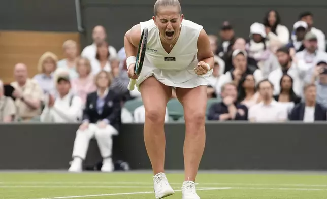 Jelena Ostapenko of Latvia celebrates after defeating Yulia Putintseva of Kazakhstan in during their fourth round match at the Wimbledon tennis championships in London, Monday, July 8, 2024. (AP Photo/Alberto Pezzali)