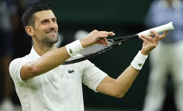 Novak Djokovic of Serbia celebrates after defeating Holger Rune of Denmark in their fourth round match at the Wimbledon tennis championships in London, Monday, July 8, 2024. (AP Photo/Mosa'ab Elshamy)