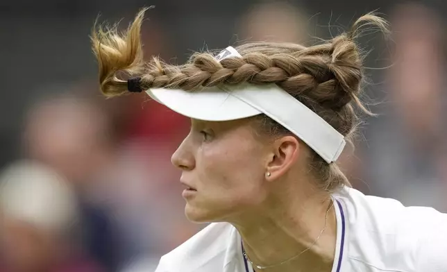 Elena Rybakina of Kazakhstan serves to Russia's Anna Kalinskaya during their fourth round match at the Wimbledon tennis championships in London, Monday, July 8, 2024. (AP Photo/Kirsty Wigglesworth)