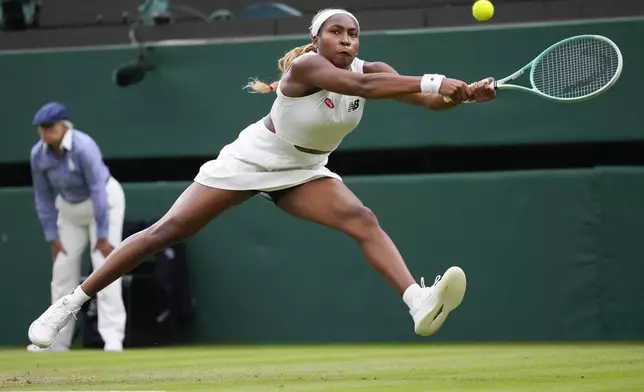 Coco Gauff of the United States plays a backhand return to Sonay Kartal of Britain during their third round match at the Wimbledon tennis championships in London, Friday, July 5, 2024. (AP Photo/Kirsty Wigglesworth)