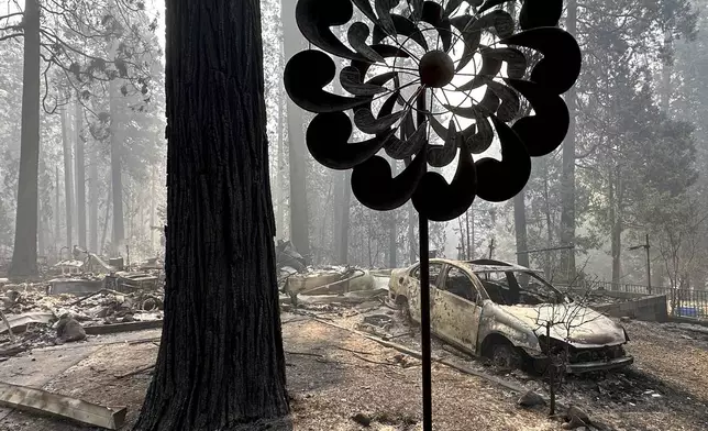 A property damaged by wildfire is seen in the aftermath of the Park Fire, Sunday, July 28, 2024, in the Cohasset community of Butte County, Calif. (AP Photo/Eugene Garcia)