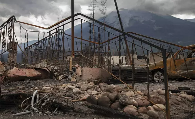 Damage is seen after a wildfire in Jasper, Alberta, Friday July 26, 2024. (Amber Bracken/The Canadian Press via AP)