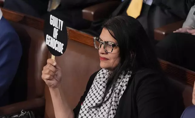 Rep. Rashida Tlaib, D-Mich., holds a sign as she attends a speech by Israeli Prime Minister Benjamin Netanyahu to a joint meeting of Congress at the Capitol in Washington, Wednesday, July 24, 2024. (AP Photo/J. Scott Applewhite)