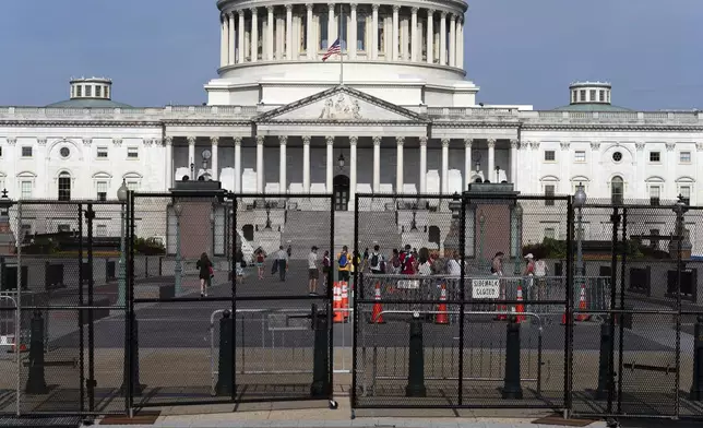 The U.S. Capitol is seen behind a security fence a day before of Israel's Prime Minister Benjamin Netanyahu visit to Capitol Hill, Tuesday, July 23, 2024, in Washington. ( AP Photo/Jose Luis Magana)