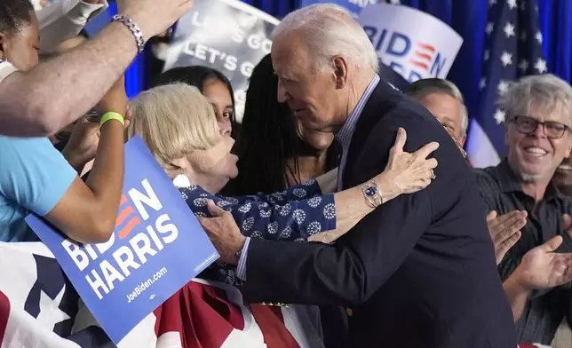 President Joe Biden, right, greets supporters at a campaign rally at Sherman Middle School in Madison, Wis., Friday, July 5, 2024. (AP Photo/Manuel Balce Ceneta)