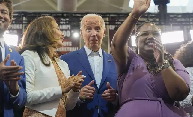 President Joe Biden on stage with supporters after speaking at Renaissance High School, Friday, July 12, 2024, during a campaign event in Detroit. (AP Photo/Jacquelyn Martin)