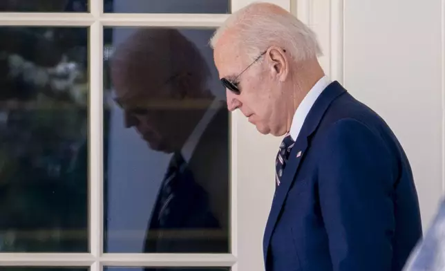 FILE - President Joe Biden walks out of the Oval Office of the White House in Washington, March 9, 2023. Biden dropped out of the 2024 race for the White House on Sunday, July 21, 2024, ending his bid for reelection following a disastrous debate with Donald Trump that raised doubts about his fitness for office just four months before the election. (AP Photo/Andrew Harnik, File)