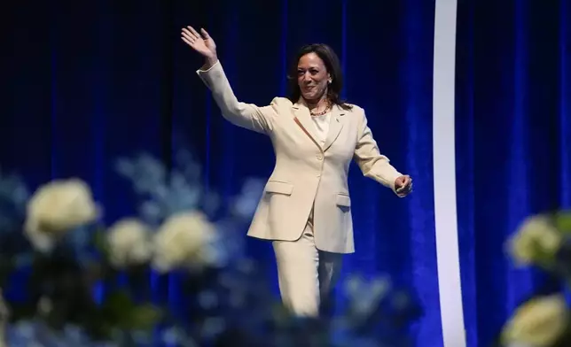 Vice President Kamala Harris waves as she is introduced during the Zeta Phi Beta Sorority, Inc.'s Grand Boulé, Wednesday, July 24, 2024, in Indianapolis. (AP Photo/Darron Cummings)