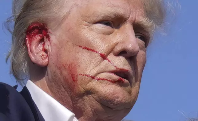 Republican presidential candidate former President Donald Trump is moved from the stage at a campaign rally, Saturday, July 13, 2024, in Butler, Pa. (AP Photo/Evan Vucci)