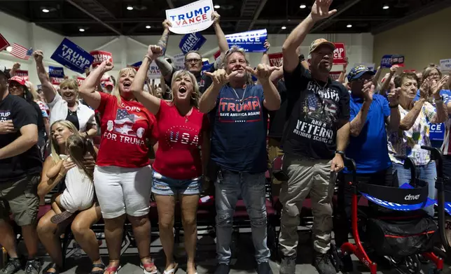 Supporters cheer as they listen to Republican vice presidential candidate Sen. JD Vance, R-Ohio, during a campaign event in Reno, Nev., Tuesday, July 30, 2024. (AP Photo/Jae C. Hong)