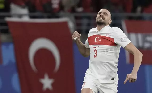 Turkey's Merih Demiral celebrates scoring his side's opening goal against Austria during a round of sixteen match at the Euro 2024 soccer tournament in Leipzig, Germany, Tuesday, July 2, 2024. (AP Photo/Thanassis Stavrakis)