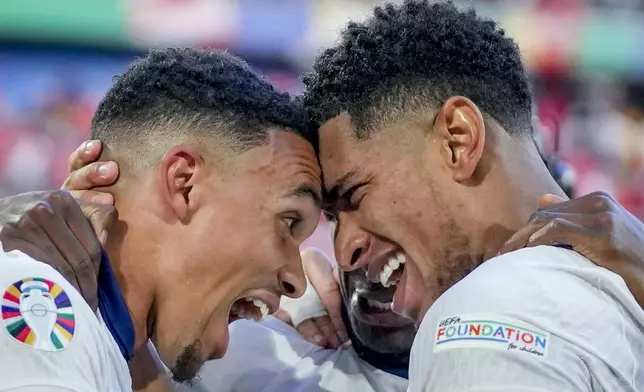 England's Jude Bellingham, right, and England's Trent Alexander-Arnold celebrate after a quarterfinal match between England and Switzerland at the Euro 2024 soccer tournament in Duesseldorf, Germany, Saturday, July 6, 2024. (AP Photo/Darko Vojinovic)