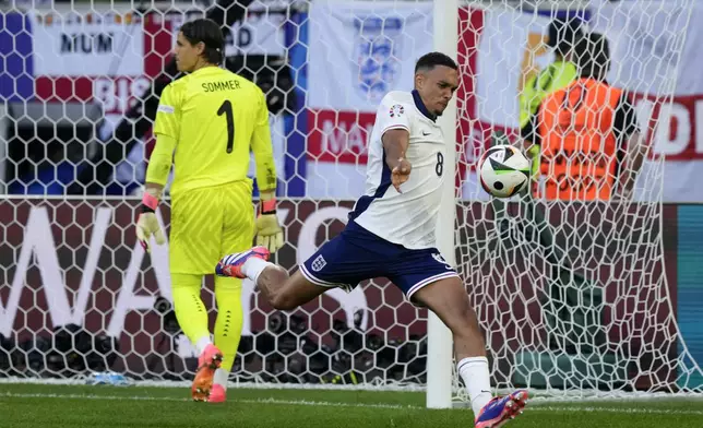 England's Trent Alexander-Arnold celebrates his team victory after the penalty shootout during a quarterfinal match between England and Switzerland at the Euro 2024 soccer tournament in Duesseldorf, Germany, Saturday, July 6, 2024. (AP Photo/Frank Augstein)