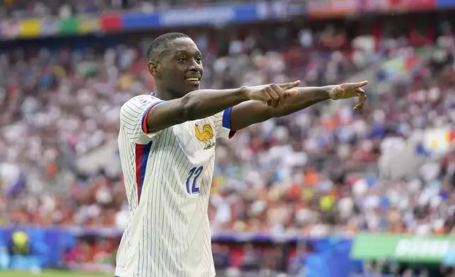 Randal Kolo Muani of France celebrates his side's first goal during a round of sixteen match between France and Belgium at the Euro 2024 soccer tournament in Duesseldorf, Germany, Monday, July 1, 2024. (AP Photo/Darko Vojinovic)