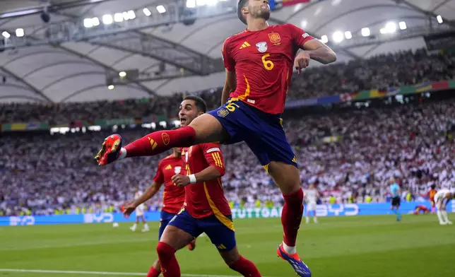 Spain's Mikel Merino celebrates after scoring his sides second goal during a quarter final match between Germany and Spain at the Euro 2024 soccer tournament in Stuttgart, Germany, Friday, July 5, 2024. (AP Photo/Manu Fernandez)