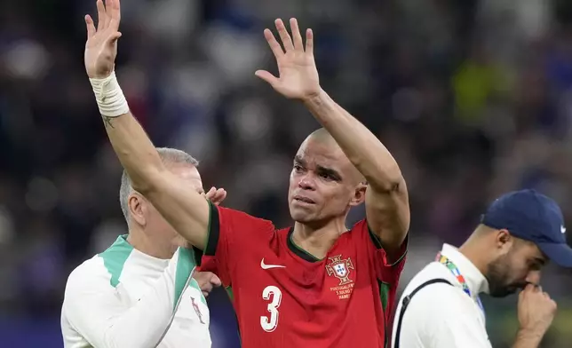 Portugal's Pepe cries after losing a quarter final match between Portugal and France at the Euro 2024 soccer tournament in Hamburg, Germany, Friday, July 5, 2024. France won a penalty shoot out 4-3 after the match ended in a 0-0 draw. (AP Photo/Martin Meissner)