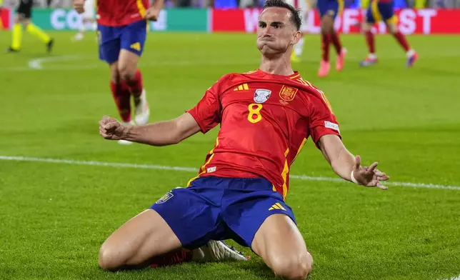 Spain's Fabian Ruiz celebrates after scoring his sides second goal during a round of sixteen match between Spain and Georgia at the Euro 2024 soccer tournament in Cologne, Germany, Sunday, June 30, 2024. (AP Photo/Manu Fernandez)
