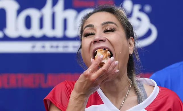Miki Sudo competes in the women's division of Nathan's Famous Fourth of July hot dog eating contest, Thursday, July 4, 2024, at Coney Island in the Brooklyn borough of New York. (AP Photo/Julia Nikhinson)