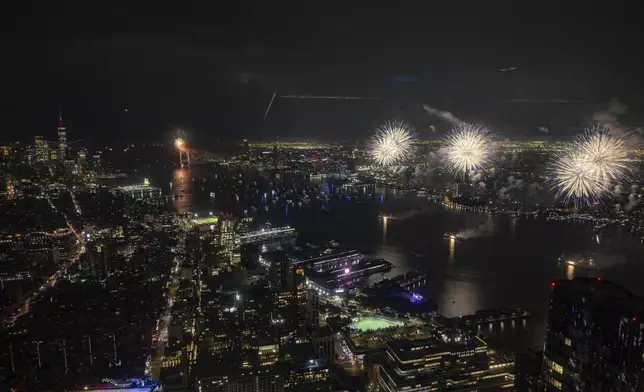 Fireworks go off in the sky during the Macy's Fourth of July fireworks seen at the Edge at Hudson Yards on Thursday, July 4, 2024, in New York. (AP Photo/Yuki Iwamura)