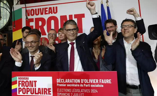 Olivier Faure, First Secretary of the Socialist Party, clenches his fist after the second round of the legislative elections, Sunday, July 7, 2024, at the party election night headquarters in Paris. A coalition on the left that came together unexpectedly ahead of France's snap elections won the most parliamentary seats in the vote, according to polling projections Sunday. The surprise projections put President Emmanuel Macron's centrist alliance in second and the far right in third. (AP Photo/Aurelien Morissard)