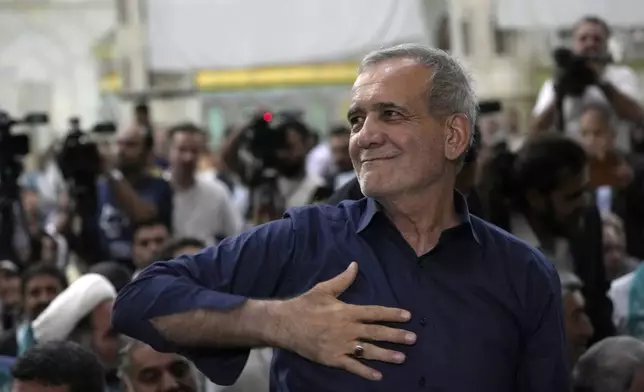 Iran's President-elect Masoud Pezeshkian greets his supporters in a meeting a day after the presidential election, at the shrine of the late revolutionary founder Ayatollah Khomeini, just outside Tehran, Iran, Saturday, July 6, 2024. (AP Photo/Vahid Salemi)