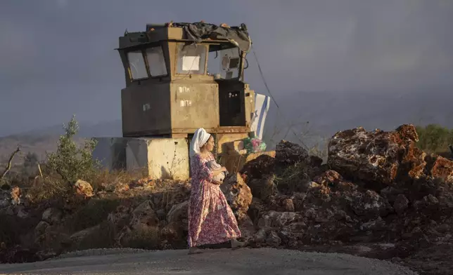 A Jewish settler comes to pray in the Eviatar outpost in the Israeli-occupied West Bank during morning prayers calling for the legalization of the outpost and the return of the hostages held in the Gaza Strip by the Hamas militant group, Sunday, July 7, 2024. Far-right ministers in Israel’s government have said they want to legalize unauthorized outposts in the West Bank in a sweeping expansion of settlements. (AP Photo/Ohad Zwigenberg)