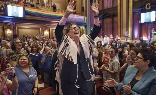 Rabbi Sharon Kleinbaum sings during her last service at the Masonic Hall, Friday, June 28, 2024, in New York. After leading the nation’s largest LGBTQ+ synagogue through the myriad ups and downs of the modern gay-rights movement for the last three decades, she is now stepping down from that role and shifting into retirement. The synagogue that she led for 32 years — Congregation Beit Simchat Torah in midtown Manhattan — will have to grapple with its identity after being defined by its celebrity rabbi for so long. (AP Photo/Andres Kudacki)