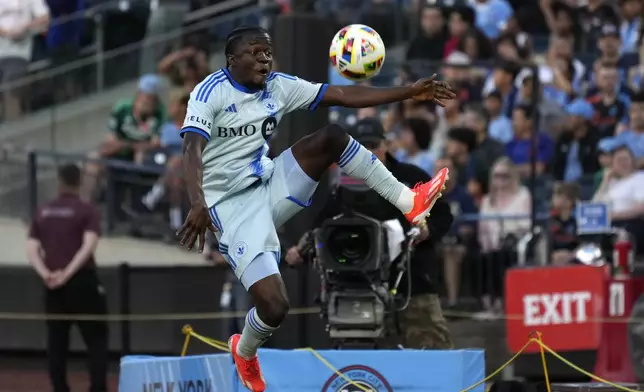 CF Montréal forward Sunusi Ibrahim catches the ball in the air during an MLS soccer match against New York City FC, Wednesday, July 3, 2024, in New York. (AP Photo/Pamela Smith)
