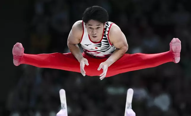 Wataru Tanigawa, of Japan, during a men's artistic gymnastics qualification round at the 2024 Summer Olympics, Saturday, July 27, 2024, in Paris, France. (AP Photo/Francisco Seco)