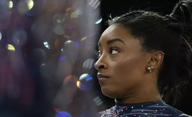 Simone Biles of the United States prepares to practice during a gymnastics training session at Bercy Arena at the 2024 Summer Olympics, Thursday, July 25, 2024, in Paris, France. (AP Photo/Abbie Parr)