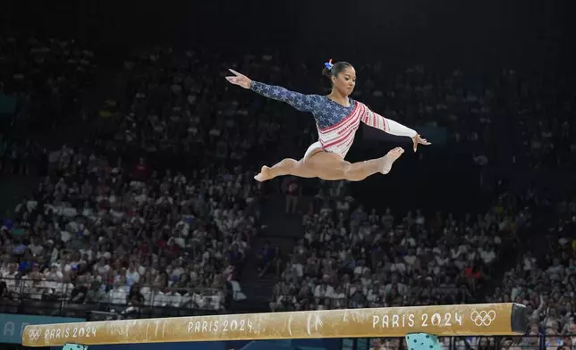 Jordan Chiles, of the United States, performs on the balance beam during the women's artistic gymnastics team finals round at Bercy Arena at the 2024 Summer Olympics, Tuesday, July 30, 2024, in Paris, France. (AP Photo/Charlie Riedel)