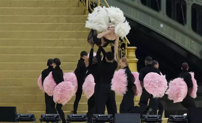 Lady Gaga performs in Paris, France, ahead the opening ceremony of the 2024 Summer Olympics, Friday, July 26, 2024. (AP Photo/Luca Bruno)