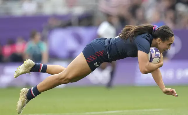 United States' Alex Sedrick scores the winning try during the women's bronze medal Rugby Sevens match between the United States and Australia at the 2024 Summer Olympics, in the Stade de France, in Saint-Denis, France, Tuesday, July 30, 2024. The US won the match 14-12. (AP Photo/Vadim Ghirda)