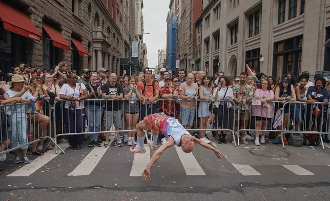 A reveler performs during the NYC Pride March, Sunday, June 30, 2024, in New York. (AP Photo/Andres Kudacki)