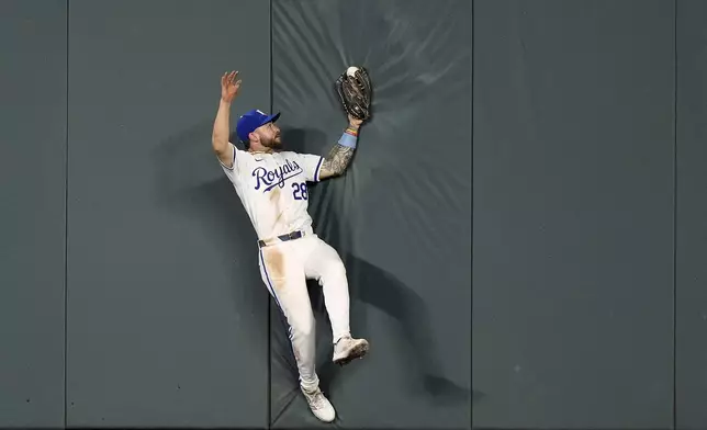 Kansas City Royals center fielder Kyle Isbel catches a fly ball for the out on Tampa Bay Rays' Taylor Walls during the ninth inning of a baseball game Wednesday, July 3, 2024, in Kansas City, Mo. The Royals won 4-2. (AP Photo/Charlie Riedel)