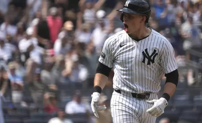 New York Yankees' Ben Rice celebrates after hitting a home run during the fifth inning of a baseball game against the Boston Red Sox, Saturday, July 6, 2024, in New York. Rice became the first Yankees rookie to homer three times in a game and drove in seven runs as New York snapped a four-game slide with a 14-4 victory over the Boston Red Sox on Saturday. (AP Photo/Pamela Smith)