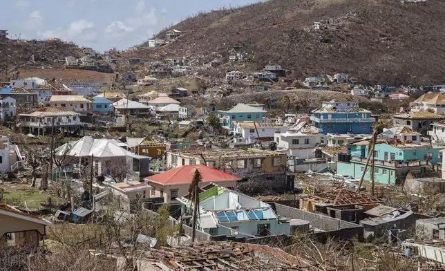 Homes destroyed by Hurricane Beryl lie in Clifton, Union Island, St. Vincent and the Grenadines, Thursday, July 4, 2024. (AP Photo/Lucanus Ollivierre)