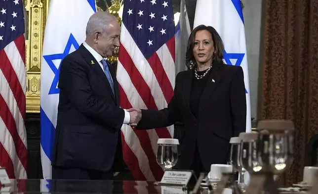 Vice President Kamala Harris, right, shakes hands with Israeli Prime Minister Benjamin Netanyahu before a meeting at the Eisenhower Executive Office Building on the White House complex in Washington, Thursday, July 25, 2024. (AP Photo/Julia Nikhinson)