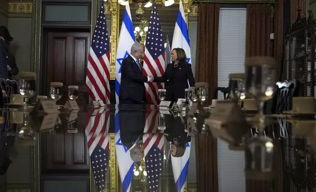 Vice President Kamala Harris, right, shakes hands with Israeli Prime Minister Benjamin Netanyahu before a meeting at the Eisenhower Executive Office Building on the White House complex in Washington, Thursday, July 25, 2024. (AP Photo/Julia Nikhinson)