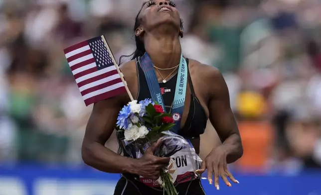 Alaysha Johnson reacts to a second place during the women's 100-meter hurdles final during the U.S. Track and Field Olympic Team Trials, Sunday, June 30, 2024, in Eugene, Ore. (AP Photo/George Walker IV)