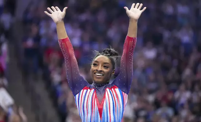 Simone Biles smiles after competing in the floor exercise at the United States Gymnastics Olympic Trials on Sunday, June 30, 2024, in Minneapolis. (AP Photo/Charlie Riedel)