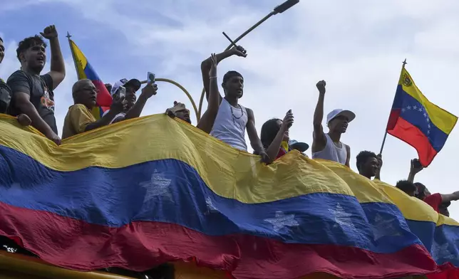 Protesters demonstrate against the official election results declaring President Nicolas Maduro's reelection in Valencia, Venezuela, Monday, July 29, 2024, the day after the vote. (AP Photo/Jacinto Oliveros)