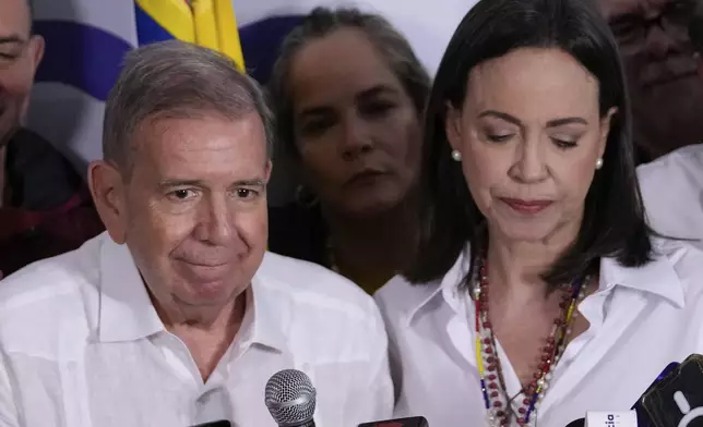 Opposition leader Maria Corina Machado, right, and presidential candidate Edmundo Gonzalez hold a press conference after electoral authorities declared President Nicolas Maduro the winner of the presidential election in Caracas, Venezuela, Monday, July 29, 2024. (AP Photo/Matias Delacroix)